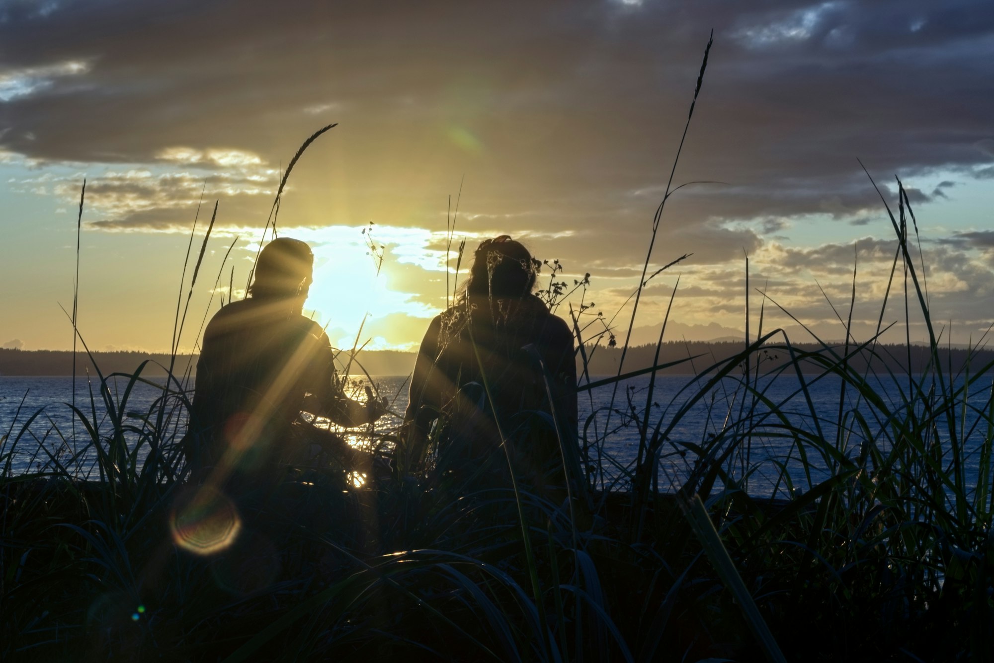 Couple in deep consversation in silhouette.